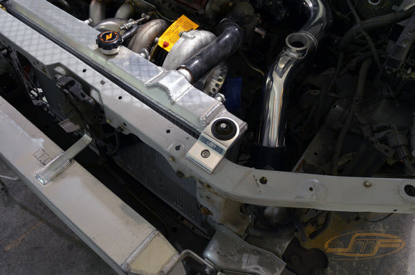 JM Fabrications billet radiator brackets. Sold as pairs, need to reuse OEM rubbers bush. Purple Color