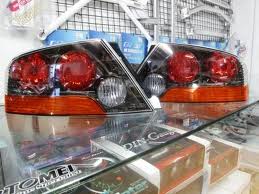 Genuine OEM Mitsubishi Tail lamps. Matt black finish. Sold as Pair.